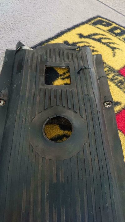A good original used Porsche pre A tunnel aluminum cover and mat - 1955,Has rips and cracks in the rubber mat .