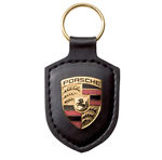 Porsche key ring metal crest on black leather strap , with metal ring