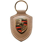Porsche key ring metal crest on beige leather strap , with metal ring