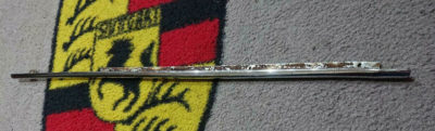 An original top window outer scrapper molding for Porsche 356A/B/C Cabriolet models 27 7/8 inches in length