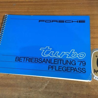 Superb condition Original Porsche 911 Turbo owners handbook dating from 1979. (German Text) has one dog eared corner bottom right and mark near spine, otherwise A1