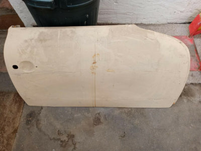 An original used Porsche 356A/B/C door right hand side 1957-65 model needs work.Please view all pictures , this door will need work to make usable , it has had previous repairs done . But will need to be re-done . Outer skin has dents .