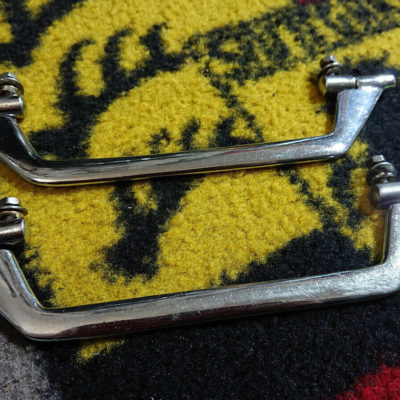 A complete pair of original early flat inner door handle pulls, These were introduced when the wooden door top wood mouldings were replaced on the Model 52 thru to the introduction of 356a model , 1952-55 . They do have the fittings and hardware , these are in good condition and ready to install .