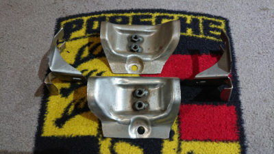 A set of 4 front brackets for Porsche 911 front bumper "S" model only . Very Slight surface rust , but brand new .