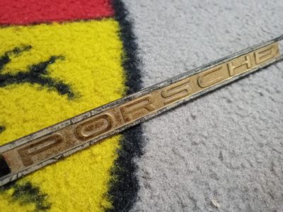 An original Porsche 356 speedster/roadster/conv D dashboard emblem , pins all present and good .