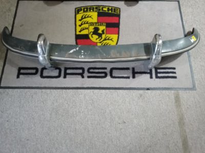 : An original front bumper , with original deco trim and original bumper guards fitted . This is for Porsche 356B/C models 1960-65. Please note the bumper requires some light work and also the mounting points inside need slight attention . Some pitting to the bumper guards is present.