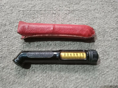 An original motometer tyre pressure gauge and pouch for 1950s VW beetle / bus , ideal for oval or split .