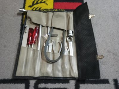 we have a Porsche 911 1969-73 LWB tool kit. This has an original bag , Original 19mm wheel wrench , 5 x original dropped forged open ended spanners . combo 19-22mm ring spanner and genuine Porsche fan belt . Then again from the KK exclusive range, a pair of the red plastic screwdrivers , superb quality , P208 generator wrench , spark plug spanner and allen key , hex pliers and a fuse pack .