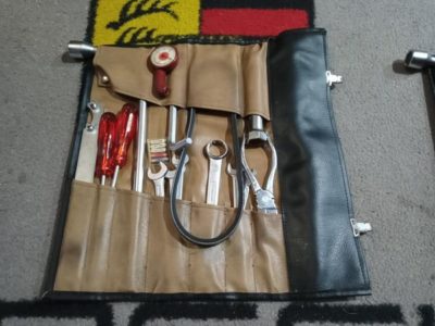 we have a superb very original Porsche 911 1964-68 SWB toolkit. This has an original bag , original 19mm wheel wrench , 5 x original open ended spanners , a combo ring spanner 19/22mm and Genuine fan Porsche fan belt . Then from the KK exclusive range , a pair of the excellent Klein screwdrivers, a P208 generator wrench, spark plug spanner and allen key and a pair of pliers and the fuse pack .