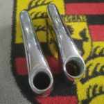 A pair of original used Porsche 356a rear overiders , with exhaust hole , Raja stamped 64450503300 and 64450503400 on the inside , some small damage to internal lip around exhaust hole, but very usable