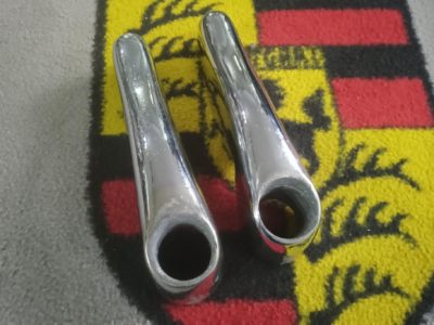 A pair of original used Porsche 356a rear overiders , with exhaust hole , Raja stamped 64450503300 and 64450503400 on the inside , some small damage to internal lip around exhaust hole, but very usable