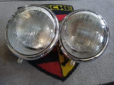 A pair of N.O.S Hella Porsche headlights 356a/bt5 1956-60 models