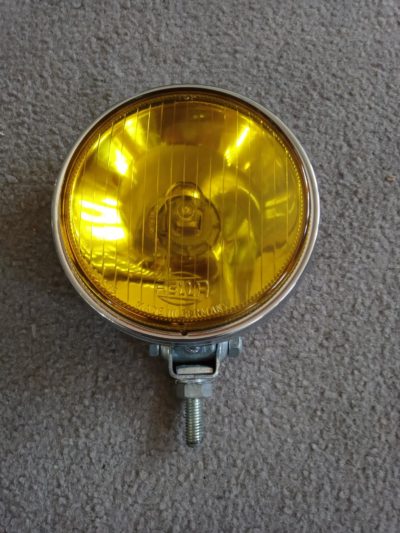 Hella yellow spot light in perfect condition 120mm Glass , Made in Germany. 1-105275. The glass and chrome are in perfect condition , ready to install .