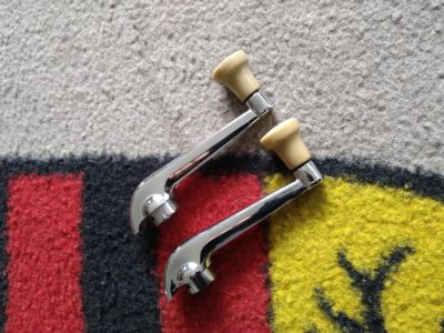 A pair of Porsche 356 T2 1957-59 Original winder handles , original ivory / tan discoloured  knobs