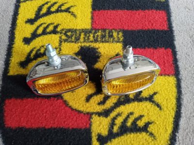 A pair of small lights yellow lens chrome backing Vw/Porsche fitment 110mmx56mm