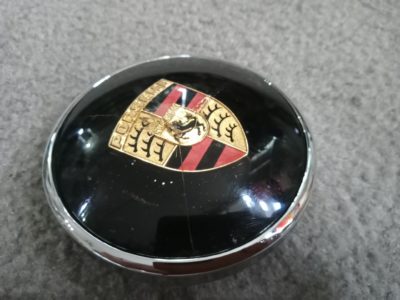 An original Porsche 356/356A 82mm horn button . This has lots of character and patina , It has 3 cracks in the face , but works perfectly . Badge colours really superb .