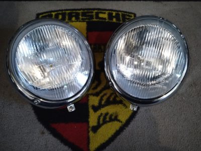A pair of Porsche 356B/C Headlamps 1960-65 RHD (Right hand drive) , but fitted with 911 H4 peak lenses