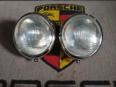 we have a nicely restored pair of 1950-53 Bosch headlights , complete with bulb holders , correct mounting screws and spacers . Large Bosch script & deeper rims . Very slight mis match on the lenses, but not discernible on the car. Ready to fit and install to your Pre A Porsche .