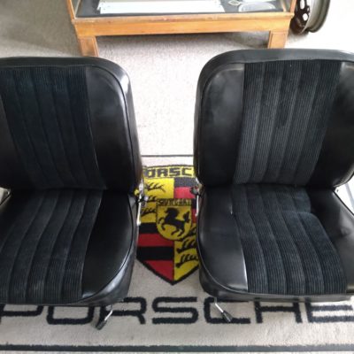 A nice pair of Porsche 911/912 SWB 1966-68 5 pleat front seats . Finished in the original black vinyl and black cloth insert . Chrome recliners are in good operational condition . These also have the original upper runners and seat adjusters fitted . Both seats have wear and age related marks , as you would expect from original parts