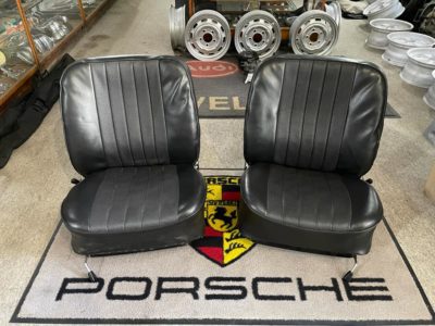 pair of original Porsche 911/912 SWB 1966-68 5 pleat front seats , overall in good working order . These are already fitted with upper slider rails , seat adjusters and also headrest brackets , have been fitted on the rear . Chrome recliners are in good order .The are finished in black vinyl and require some minor re-padding to the back rests . and tidying up of the bases .