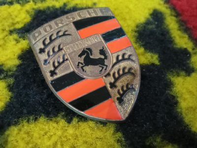 A superb original front orange bar hood emblem for early Porsche 911/912 models 1965-73. This has had small parts of the enamel touched , the fixing pins are in great shape , has the R 901 on the reverse .