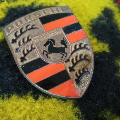 A superb original front orange bar hood emblem for early Porsche 911/912 models 1965-73. This has had small parts of the enamel touched , the fixing pins are in great shape , has the R 901 on the reverse .
