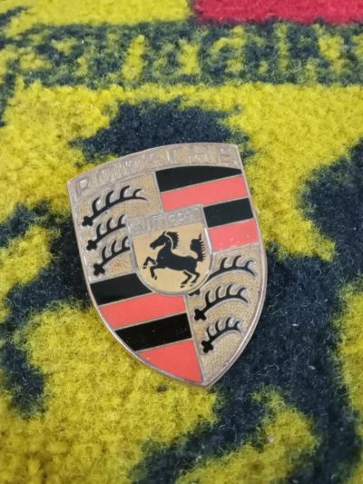 A really superb original Hood badge for a Porsche 911/912 up to 1973. This is a great example of a 1960s original badge .There was a slight piece of small orange enamel missing, but this has been touched in, please view all pictures carefully, the pins are perfect .This would suit a great original car