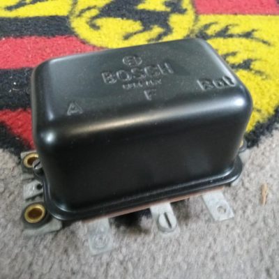 An original used Porsche 356 A/B/C Voltage regulator , This was working when removed , top has been repainted and detailed .