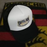 Outlaw black and white trucker cap