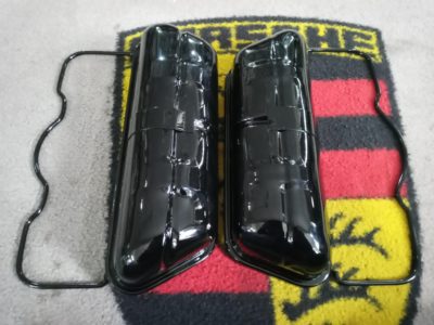 A pair of original used Porsche 356 original rocker covers , including bail arms . These have been blasted , primed and finish in 2k gloss black . Ready to install .