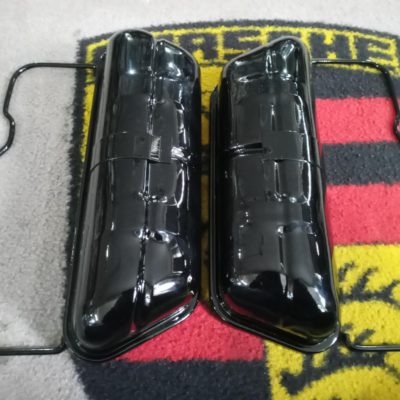 A pair of original used Porsche 356 original rocker covers , including bail arms . These have been blasted , primed and finish in 2k gloss black . Ready to install .