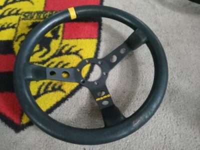 A used original deep dish Momo steering wheel, 350mm dia black