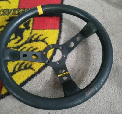A used original deep dish Momo steering wheel, 350mm dia black