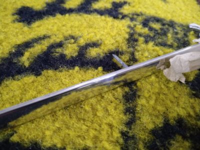 A NOS genuine Porsche polished Aluminium Tack Strip. This fits above the Rear Window on a Porsche 356A T2, 356B, and 356C Cabriolet. It is in excellent condition and is complete with embedded nails.